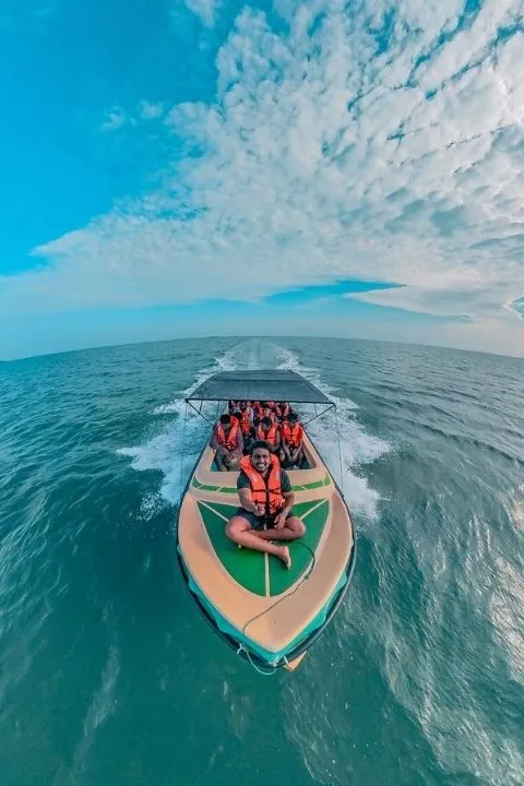 Group enjoying a speed boat ride across the open sea