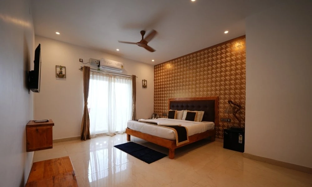 Nirvana AC room with balcony bedroom at Suggee Resort