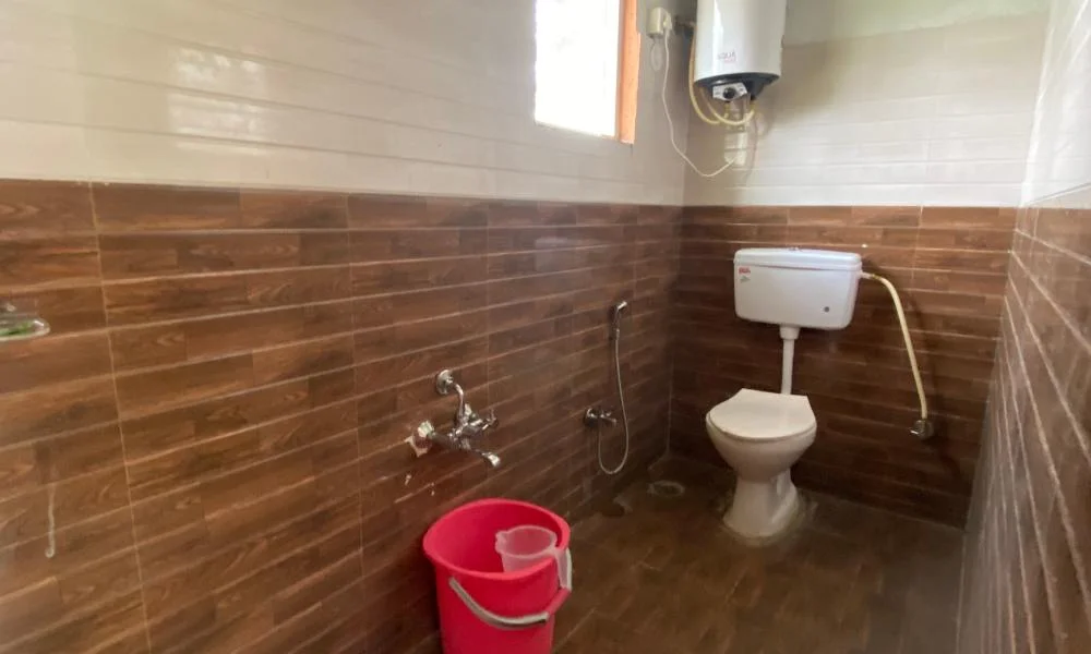 Washroom in Suggee Resort's Wooden Rooms with Modern Amenities.