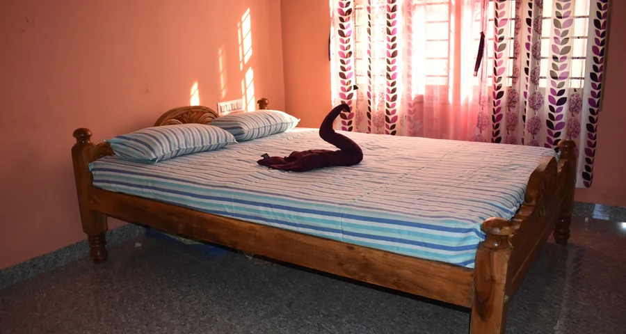 Bedroom with natural light at Borrbo Nests, homestay in Chikmagalur