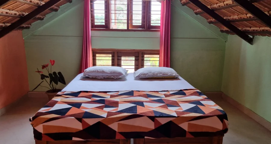 Bedroom with clay roof tiles at Borrbo Nests, Homestay in Chikmagalur